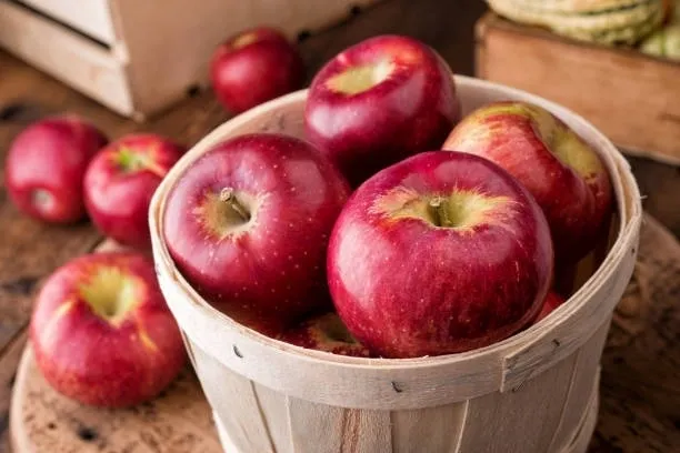 A close up of apples in a basket